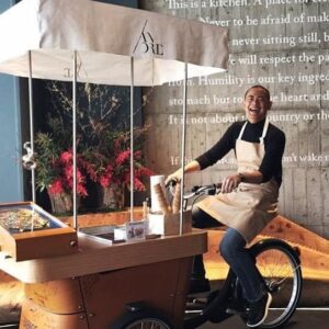 André Chiang Instagram - Since the first day I met Mr. Ng “The ice cream uncle”, we built a mutual bond and relationship beyond words, his passion to his work inspired me to create something just for him- to raised a national donation to improve his living quality.

I remembered him saying to me “I don’t want donation, I simply want to sell ice cream”… I totally respect that but how many ice he could possibly sell per day? 
so we created Restaurant ANDRE’s “Ice cream uncle” dessert to sell the ice cream for uncle Ng, by offering him all the profit and donation by the end of the year to him. 

I believed it was just a token gesture to raise awareness, most importantly to get the public attention to protect and support this living treasure- oldest ice cream uncle at age of 92 doing what he’s passionate about ; we successfully to sell thousands of ice cream over the year, forwarded tremendous guests to visit his stand near Sim Lim tower. 

I’m sure Mr. Ng will continue selling ice cream, bring the happiness and this Singapore culture to wherever he is; and for everyone out there, please support all the living treasure while you can, support their passion as well as supporting them to continue being beautiful memories to the world. 

自從我第一次見到黃先生（“冰淇淋叔叔”）以來，我們建立了超越言語的互信和關係。他對工作的熱情激勵我為他創作 — 我們發起全國捐贈來改善他的生活質量。

我記得他對我說：“我不想要捐款，我只想賣冰淇淋”……我完全尊重他的想法，他一天能賣多少冰淇淋呢？但他答應讓我們”幫他賣冰淇淋”; 於是我們創作了Restaurant ANDRE的“冰淇淋叔叔”甜品，為黃叔叔賣冰淇淋，然後在年底將所有所得交給他、當作是”賣冰淇淋的錢”。

當時我認為這只是一個象徵性的舉動，來提高人們的社會意識和關懷，最重要的是吸引公眾關注對老年從業族群及文化資產的保護，保護及支持這位活國寶—92歲高齡的新加坡冰淇淋叔叔，繼續做他熱愛的事情。我們成功地在Restaurant ANDRE一年內賣出了數千份冰淇淋，並吸引了大量顧客去支持他在SimLim大廈附近的攤位。

我相信黃先生會在天上繼續賣著冰淇淋，為所有人帶來歡樂並將這種新加坡文化傳遞到他所在的每一個地方。希望大家都珍惜生活周遭的”活國寶們” , 支持他們的夢想和他們為世界帶來的美好.