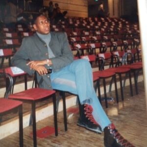 André Leon Talley Instagram - André Throwback:  The moment in time, waiting alone, in the basement of the Louvre, for a Valentino show to  begin.  I am wearing,  a beautiful gray twill Chanel jacket with brass buttons and four pockets, designed just for me by Karl Lagerfeld. It was the second jacket he made for me in the couture, and at that time, M.Pacquito was chief of tailoring.  My turtleneck is English cotton, and my officer trousers with the contrast stripe are from Welsh & Jefferies, Savile Row.  It is  where the English Royals go  for military dress.  I have many trousers like this in every conceivable color and contrast, best ones, evening dress, with big gold braid.  The shoes, inspired by
a pair of 1930s ski boots in the Hermès archives, Paris.  I loved them so much, simply because they had red shoelaces,and still have them in my Paris archives closets in North Carolina.
That was when I felt like life was all sunshine, and very few dark clouds. I did make it into the Intrenational Best-Dressed Hall of Fame. Look at how I look, what a grand and elegant giraffe, if I had to compare to another creature. #valentino #hermes #paris #welshandjeffries #thechiffontrenches #armani #amyfinecollins #tbt