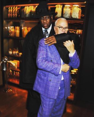 André Leon Talley Instagram - Manolo Blahik and yours truly in Manhattan, somewhere.  We are like brothers and have always been.
Manolo is the most elegant man I know.  He could have been an interior architect, a set designer, as well as shoe king. He has designed beautiful wrought iron furniture, that he cast in his beautiful town, Bath, England.
Manolo has a marvelous house  on the Crescent in the historical city of Bath.  We used to spend glorious weekends in his Luchino Visconti  rooms, he decorated on his own, with roaring fires watching Visconti films before there were cable boxes. He had all Visconti and Bertolucci films in his library.  My favorite pastime, was to walk into town to the bookstore and come home, and watch Manolo bake a cake in his AGA oven.  The house had all the style of those great English homes you see where cozy means really cozy, yet it is grand.  Oh, did we laugh, just the two of us. My best country house weekends were spent with Manolo in the Eighties, just the two of us.

I once went to London and spent an entire week, reading to him, the entire works of Camille Paglia: Sexual Personae and Sex, Art, and American culture.  Out Loud.  The main purpose of my trip was to sit by his bed, every day from eleven a.m. to four p.m. reading out loud, in a clinic where he was convalescing after surgery. We had the best time, as he lay in bed and I sat there, every day having very little food and reading out loud from Paglia’s great essays.  I met Bianca Jagger through him, she has all his great designs from decades in storage.  Manolo Blahnik's suits from Anderson and Sheppard are the most dandy, pure dandy suits ever ordered. These are moments in time, timeless, precious and always there.  #vogue #thechiffontrenches #manoloblahnik