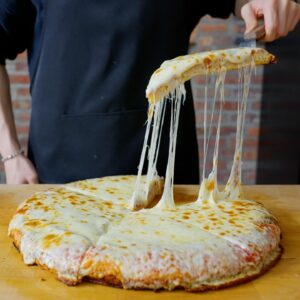Andrew Rea Instagram - The cheese pull of dreams. On today’s Anything with Alvin, @alvin.zhou makes pizza al trancio. It’s a good reminder that sometimes a cheese pizza is all you need.  Link in the tree 🍕