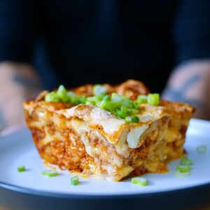 Andrew Rea Instagram - Since time immemorial, mankind has wondered: should lasagna include a fully-loaded baked potato? Or rather, only Gene Belcher has. The answers to that question and more on today’s Binging, where I recreate Gene’s Fully Loaded Baked Potato Lasagna from @bobsburgersfox - live now, link in tree!