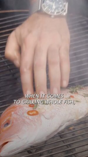 Andrew Zimmern Instagram - My favorite fish to grill? Red snapper – it’s versatile, it’s economical and it cooks quickly. Watch as I share a few simple tips to take your grilled fish to the next level. 

I like to season it with a simple garlic and herb olive oil marinade, and serve it with a mixed herb salad and grilled lemons. 

Click the link in my bio for the complete recipe.