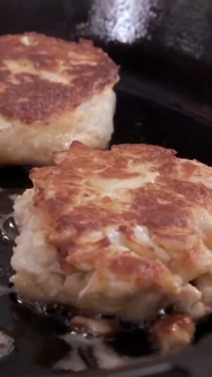 Andrew Zimmern Instagram - This is my favorite crab cake recipe. It’s a true Baltimore-style country club crab cake, without filler ingredients. I make these in double batches and put the leftovers in the fridge... And if you haven’t eaten a cold crab cake on toast with sliced tomato and Russian dressing, you’re missing out! 

Get the full recipe on my website – link in bio.