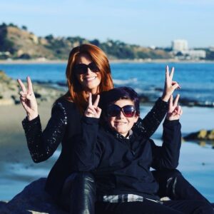 Angie Everhart Instagram - #peace #lovemyson #wearingmysunglasses #photoshoot @thebeach #fuckthispandemic #peaceout