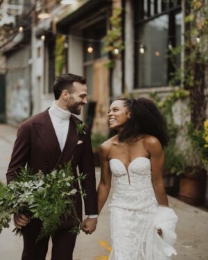 Anna Uzele Instagram - We woke up together, wrote vows together, got dressed in our home together, and walked down the aisle together. And that’s how we aim to spend what short time we have left ✨together✨

Introducing Anna & Glenn Vasaturo

photo: @laurabriggsphoto 
hair: @shespeaksmusic 
makeup: @estabrookartistry 
tailoring: @theweddingdresserstudio 
florals: my mama @christineuzele 
decor: @bycatherinealexandra 
suit: @suitsupply 
venue: @brooklynwinery
officiant: @johnnyleeb3