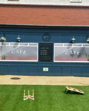 Anneka Rice Instagram - Oh my goodness. I went to Birkenhead, near Liverpool, today, to visit our Dementia Village, built on Challenge Anneka in 2022. It is flourishing. On a piece of wasteland a team of epic volunteers, builders, craftsmen, built an entire memory village - with pub, post office, record shop, cafe, bakers, cinema, bowling lawn, landscaped gardens! We worked in the pouring rain, in a recession, it was beyond stressful - but I thought my heart would burst, visiting it in the sunshine today, seeing what a difference it has made in this Wirral community. They now have over 400 volunteers helping out. The idea is that someone with dementia can wander safely round the village, dropping in on shops, listening to their favourite record, watching a film, having a singalong in the pub, doing whatever they want. It’s liberating for them and their loved ones because on every corner, sitting in the shops, offering them a cuppa in the cafe, there are carers to help them, chat to them, play bowls with them, sing with them. Each shop is curated to trigger memories. I went down a rabbit hole of memories seeing the Green Shield Stamps in the Post Office! IT IS BRILLIANT. I would love to see this rolled out across the UK. Well done @ageuk_wirral for having such vision 🩵🩵🩵 @age_uk #dementia @alzheimersresearchuk #village #ChallengeAnneka #charity #volunteers #community #joy @channel5_tv