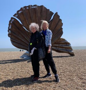 Anneka Rice Instagram - A date for your diary. Next Thursday 3pm Radio 4, an Open Country special. About my mentor and teacher Maggi Hambling. We travel around the Suffolk countryside, to explore the landscape that has inspired her phenomenal body of work. We sit on the beach where she sketches, and talk about how the crashing of a wave is like the moment of orgasm.. And how The Scallop, reviled when it was first erected, has now become a beloved symbol of Aldeburgh. It’s tender and majestic, rather like Maggi to be honest…#maggihambling #thescallop #sea #painter #suffolk @bbcradio4