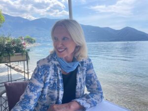 Anneka Rice Instagram - I seem to be in Switzerland! With a pole sticking out of my head! Oh God, this place! I’ve wanted to return since my last visit when I hung off a winch on a helicopter on top of a mountain looking for a clue! Lake Maggiore is so peaceful, surrounded by mountains and lush greens. Just bracing myself for a bike ride up a mountain. #swizerland #lakes #mountains #summer... @ascona_locarno @ticinoturismo you