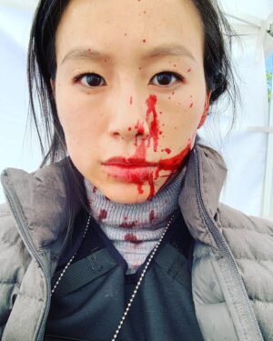 Annie Chang Instagram - Episode 6 of @hbomaxpeacemaker is out today!  And if you’re wondering, do I really wanna, do I really wanna taste it? The answer is no. Fake blood tastes weird. #peacemaker