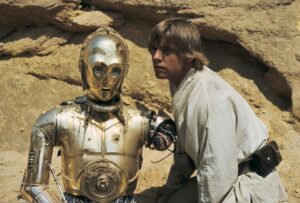 Anthony Daniels Instagram - @mario.basilicata asks which is my favourite Star Wars film. 
As a film to watch, the answer has to be A New Hope. Love this shot with Luke when Threepio’s left arm had become detached during a Tusken Raider attack. Note the bumps on Threepio’s head and chin. Read the book, pages 49 – 50, to find out how we got this shot to work.
But my favourite film to act in? Different answer.
#anewhope #lukeskywalker @hamillhimself #c3po #threepio #tatooine #tuskenraider #iamc3po @dkbooks