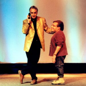 Anthony Daniels Instagram - What a disappointment that there’ll be no Celebration this year.
Here, a warm (if damp) memory of me and Dan Madsen, mighty producer of the FIRST CELEBRATION EVER in 1999, in Denver, in the rain. (I produced the gold jacket)
Were you there too?
#StarWarsCelebration @starwarscelebration #starwars #c3po #iamc3po #1999 #denver
