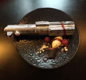 Anthony Daniels Instagram - Fabulous chocolate art created by the patisserie section @corinthialondon
#chocolate #lightsaber #theriseofskywalker @starwars #chocolateart #iamc3po