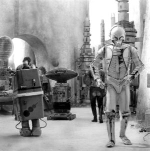 Anthony Daniels Instagram - @taaaaammy.08 asks if I played any other protocol droids. Protocol droids, no, but I did walk through Mos Eisley spaceport as CZ-3, a secretary droid, in A New Hope. CZ-3 was seen again in the sandcrawler, but this time without me inside. Then again in Return of the Jedi. See Chapter 24 of the book. 
Apparently, Mitsubishi has a car with the same name. Four wheels but no hyphen.
#cz3 #c3po #anewhope #returnofthejedi #starwars #moseisley #sandcrawler #iamc3po @dkbooks @dkbooksus #droids #gonkdroid