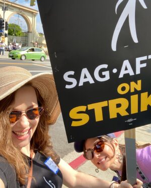 April Billingsley Instagram - I ran into some #FSUFilm school friends who are WGA on the picket line at Paramount on Monday! @zayasnick and #erincancino FSU represent! 
I believe the quote from Erin was was “I thought I’d run out of people I could run into”. I do now really wish we had somewhere to picket in Atlanta because it was really good for my moral to walk back forth with a sign and feel like I was doing something. We’ve had rallies that were great here in Atlanta, but being on the actual picket line, it was a bit of a different vibe and it was really nice. At Paramount the “special picket” for the day was a “Character Actor’s March” so my character actor name I put on my name tag was “girl who dies” and my friend @annunziataactor Nunzi’s was “crack addict” 🤣 Because pickets only happen on weekday mornings I was only able to go to one and I’m really glad I did. @fsufilm #sagaftrastrong #wgastrike