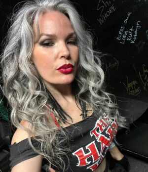 April Schutte Instagram - Just realized the writing behind me 🤷🏻‍♀️ Oh well. Had a blast last night dancing at @thewhiskyagogo ! At 42, apparently I’ve still got it. 
.
.
.
#gogodancer #maturewoman #whiskyagogo #hairmetal #80smetal #greyhairdontcare #silversister #greyandwhite #silverhairdontcare #greyhaircolor #silverhaircolor