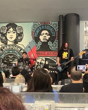 April Schutte Instagram - Well, I finally got to see @dogstarband live 😭 What a gift! (Swipe!) Thank you to @bretdomrose @robmailhouse and Keanu Reeves for giving us this special show at @amoebahollywood !!! I’m forever grateful to my pal, Jax for getting my cd/ticket for me and for @vanessaburgundy for the heads up that the show was happening!! I had to hold back some happy tears but I just kept singing and dancing!!! Hope to get another chance to see them in the future!
.
.
.
#Dogstar #keanu #amoebamusic #bretdomrose #robmailhouse #rockshow