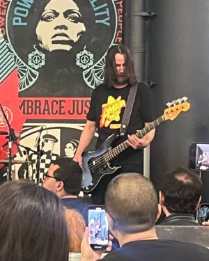 April Schutte Instagram - Well, I finally got to see @dogstarband live 😭 What a gift! (Swipe!) Thank you to @bretdomrose @robmailhouse and Keanu Reeves for giving us this special show at @amoebahollywood !!! I’m forever grateful to my pal, Jax for getting my cd/ticket for me and for @vanessaburgundy for the heads up that the show was happening!! I had to hold back some happy tears but I just kept singing and dancing!!! Hope to get another chance to see them in the future!
.
.
.
#Dogstar #keanu #amoebamusic #bretdomrose #robmailhouse #rockshow
