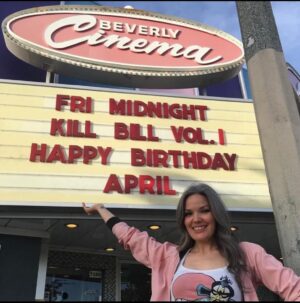 April Schutte Instagram - The tradition of posting this birthday photo continues! Epic photo from my New Beverly Birthday and my double feature of ‘Escape from New York’ and ‘Big Trouble in Little China’! Thank you to everyone for all of my birthday wishes yesterday! We had a super busy and fun day! Thanks to @shawnslaught for spoiling me! 
.
.
.
#happybirthdaytome🎉 #NewBeverlyCinema #birthdaygirl🎀 #43yearsold #greyandglowing