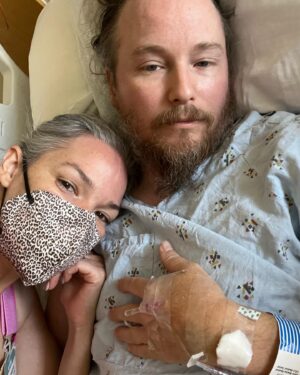 April Schutte Instagram - Shawn is home! Home with us and recovering ❤️‍🩹 This was the hardest and worst week ever…One week ago, Wednesday evening we went to the ER because Shawn had extreme stomach pain that wouldn’t stop and kept worsening. Hours of waiting lead to them finally diagnosing him with appendicitis (I had assumed this hours before but we were hoping it was food poisoning). They decided they needed to do surgery the next day and in the meantime kept pumping him full of antibiotics and pain meds (which did nothing the first day!) They then kept pushing his surgery back and as the time passed, his pain and swelling got worse and worse. They finally went in and his appendix had perforated just as they were starting to remove it! Once in recovery, there were some minor issues that are too gross to mention…then on the other side of surgery, there were SO many things that kept happening to make this a lot more challenging (and painful) than the average appendectomy. His organs were “dormant” and wouldn’t wake up and function properly…his belly bloated up so badly, causing even more pain, he couldn’t even keep water down without painfully vomiting because of extreme heartburn. It was so hard to see Shawn like this and to leave him there…Grey and I went to visit every day, twice a day. It was hard to find help as everyone has their usual routines and responsibilities, but Grey was a model visitor and the nurses all looked forward to seeing him. They were amazing. A time we were able to get help, and we are so grateful. @ghoulygrrrl and her family took care of Grey for one of the days when I needed to work a modeling (that’s a whole other ball of stress I’ll get into later!) They took him into their home and gave him so much love! Well…I meant to make this short…just so fucking grateful that my love is healing and getting better each day. With that, my anxiety is slowly starting to relax a bit…and one more thanks to all of our friends and family who texted every day! We love you 🖤 And to my lovely clients, I will get you on my books ASAP! (Last 2 photos are from today! We all got out for a slow walk on this beautiful day and had some vegan ice cream)