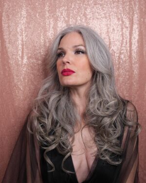 April Schutte Instagram - Took these for an upcoming show! Details to come! Thanks to @shawnslaught for the shots! More of these to come too!
.
.
.
#AprilShowers #glamourshots #hammerhorror #vampirestyle #countess #OnceBitten #greyhairdontcare #silverhairmodel #silversisters #luxyhair #lipbar #bawselady