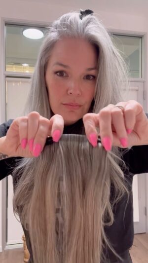 April Schutte Instagram - Finally, the reveal! It’s @luxyhair and I am in love!
These are the 20” Seamless Light Gray Clip-Ins (180g). I used 4 out of the 10 pieces. They have a slight beige undertone that works perfectly with my hair. As you see, the top of my hair is more silvery white, but under that crown area (where the extensions go), is darker, so the blend is seemless. I have a more detailed video up on TikTok if you’d like to go check it out. IG only allowed 90seconds! 
.
.
.
 #Luxyhair #silversister #behindthechairstylist #hairstylistlife #hairtutorials #silversisters #greyhair #greyhair #greyhairdontcare #ditchthedye #hairextensions #behindthechair