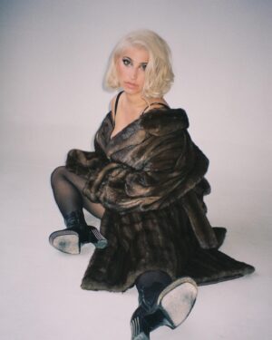 Ariana and the Rose Instagram - Been a mob wife my whole life 🤎
.
📸 @chaineley 
MUA @amandathesenbeauty 
Hair @coreytuttlehair
