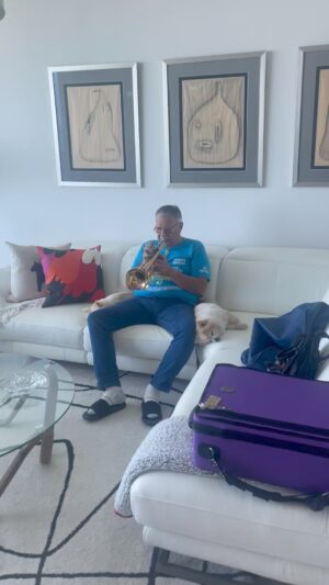 Arturo Sandoval Instagram - Doing long tones and our babies relaxing on my side.