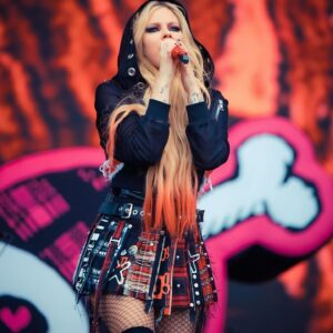 Ashton Michael Instagram - 🇬🇧 🧷☠️ AVRIL ☠️🧷 🇬🇧 
.
@avrillavigne performing @glastofest in custom Ashton Michael was one for the books . Such a rad moment to create this look for such an incredible festival . A nod to OG UK punk culture , sprinkled with Avril energy, completed with classic Ashton Michael esthetic .
 
.
You killed it babes … 
.
.
#ashtonmichael #avrillavigne #glastonbury #mfp #queenlavigne #punktsugicollection