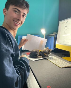 Aymeric Jett Montaz Instagram - This is the new member of @goldgrowthgiveaways 

NO, HE IS NOT THE GIVE AWAY PRIZE!😂🤪

It’s pretty hard to concentrate when the cat sits on your papers but at least he’s cute, right? 😂 

We didn’t name it yet… 
give us some ideas in the comments! 

Love you guys! #ggg #giveaways #cats #millionnaire