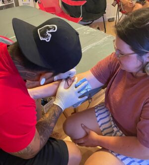 B.K. Cannon Instagram - What better way to celebrate my 25th year at @campanuenue than with my very first tattoo! I’m proud to have this tribute etched on my skin because the love that is Camp Ānuenue will forever be etched in my heart. As a Director, my dedication to this program and our ohana is fueled by the years of acceptance, guidance and encouragement I received as a camper. 🌈♥️
•
Thank you to Chanse for making this happen for us, I’m so glad to share this experience with the wifeys @24fussy @__uluwehi @xcelsior_56 (honorable mention @caraspapayas)