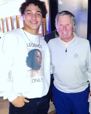 Barry Jenkins Instagram - Chaos alert — first of all, give a follow to my adopted cousin @donovan_mcmillon3 so he can wrack up those NILs 💸🤣🤣🤣

Second, if you know me and Joi McMillon at ALL then you recognize the chaos in this pic: Joi, lifelong and diehard FSU Football fan, pictured here on a sweatshirt (printed by yours truly) worn by her nephew, a scholarship athlete on the UF football team, buddy buddy with THEE Head Ball Coach, Steven Orr Spurrier 🤣🤣🤣🤣 — I like to think that Joi is here protesting all things Gator with her presence 😜