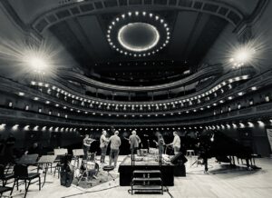 Béla Fleck Instagram - Here are some "ReFlecktions" Jen Hughes sent me after the show at @carnegiehall. 

• The way Béla met Bruce Hornsby and dove deep together into the depths of “The Way It Is” and danced with each other to bring it into a life of its own: a way it has never been played before. It was stunning. It sounded so good; I practically wept. So amazing to see two soulmates create before one’s very eyes - - and with such a beautiful tune.
 
• Similarly, with Zakir Hussain – a Béla brother from another mother. Those two have such a great connection; it just shines and resonates. When they were trading “riffs” with each other, it was so fun for the audience, but also jaw-dropping. Again, witnessing masters at work - - but, also, at play because it appears they so enjoy playing with each other.
 
• The clarinetist! Anat Cohen, for crying out-loud! What a find and such a great executed idea to have her play with you. She is cut from the same cloth - - a rare thing! Her on Juno, in particular, was pure joy in action.
 
• Rhapsody. Rapt: the whole hall! I knew I would love it. I had not seen it live before: just some pieces during some of Béla’s solos, never with a symphony. It was striking how much I loved hearing it live with a symphony. It was powerful, riveting, and perfectly delightful! And, absolutely masterful during the part where the symphony fell away and Béla played virtually all of their parts on his banjo alone. Literally breathtaking. Bravo. Also, the talent of those Jacobsen brothers. And, how uplifting to see Edgar Meyer’s son in the orchestra. I suspect Béla has known him all his life. Sweet. Awesome that Béla wore that jacket for the Rhapsody segment of the show. That jacket is the best.
 
• My Bluegrass Heart. I will never get enough of it. Legendary playing by all. Slippery Eel. Whoa! I think I broke a sweat it was moving so fast. Béla slayed it. Rhapsody in Blue(grass) was to die for. The ever-beautiful Big Country. The addition of Zakir’s percussion was phenomenal, and every time Michael Cleveland played the part that I always think of as when the angels sing or the eagles soar my heart skipped a few beats.