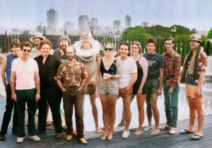 Béla Fleck Instagram - From the album insert to Nanci's "Once In A Very Blue Moon": The Jim Rooney 1984 Once In A Very Blue Moon Olympic Sink or Swim Team... 
What a team of all-stars, some huge talents in this photo!
Back in the 80's, Blue Moon Orchestra atop the Americana: Bela Fleck, Lloyd Green, Richard J. Dobson, John Catchings, Pat Alger, Ralph Vitello, Jim Rooney, Nanci Griffith, Stephen Doster, Denice Franke, Lyle Lovett, Roy Huskey Jr, Jack Grochmal.

@lyle_lovett @belafleckbanjo @craftrecordings
@acltv

#nancigriffith #onceinaverybluemoon #1984 #80s #swimmingpool #