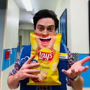 Ben Feldman Instagram - SMILE!! According to “HR” I’m not “allowed” on “set” until i get a real “mask” but anyway  @lays is sharing the smiles and stories of people who are inspiring joy and positivity in their communities w limited edition bags! Plus they’re donating $1 MILLION in support of @operationsmile, a charity that I have supported for years! They were nice enough to send me a custom bag with my horrifying smile on it. Tell me how you’re spreading smiles by picking up a Lay’s Smile bag today and using #SmilewithLays