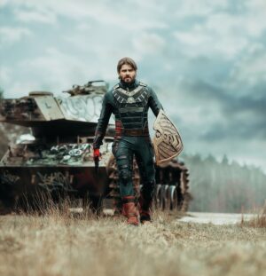 Ben Schamma Instagram - Soldier Boy is here! 😁
I’m so looking forward to the next season “The Boys”. But June isn’t too far away. In the meantime I thought I could cosplay Soldier Boy. What do you think? Next will be Homelander and then I did the best three characters and maybe I’ll create some cool (photoshopped) pictures with Billy, Soldier Boy and Homelander in one picture. ☺️
Suit by the best super hero supplier @parallellifestudios 
Make up by the amazing @majafelicitasb 
Pic by the fantastic @eosandy_ 
Tank by WWII
and shield by me. 😄
#theboys #soldierboy #soldierboycosplay #cosplay #cosplayer @theboystv #superhero #malecosplay