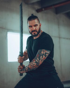 Ben Schamma Instagram - SOLD OUT! 🥹 ✨Shoplink in my bio! My dearest Maulies, this is special for me. 💪🏻 May I present the Maul Cosplay Katana? ⚔️😁 

Since I held the beautifully made Witcher LARP swords from @calimacil_official in my hand for the first time I’ve always wanted to work with them and create my very own LARP Katana. I designed it to look futuristic, modern and a „little“ maul-ish. 👺 With the awesome skill and experience of Calimacil, it now has become reality.  When I got the first one straight from Canada, I felt so proud to hold my very own foam sword in my hand. Especially because I think they make the best LARP swords and this collab is an honor for me! 🥹

We made a pop-up store for you to get this directly from me (link in my bio) but you can also get it at @calimacil_official !

⬇️ Special Launch Offer: ⬇️

There will be 15 limited special edition swords (last pic but only a drawing) in a bundle with a tshirt (pic #3) which is only available together with the sword and you’ll get a signed print of course! The special edition sword has a slightly different color scheme than the regular one. See that cool guy on the shirt that @iamfragment and I made? Could be a Ronin Sith relative of our boy Darth Maul. He needs a name though, any ideas? 💭

Anyway, if you are interested in the special edition bundle check out the link in my bio.

I hope you like my sword.
I really like my sword.
Do you like my sword?
Buy my sword. 🖤

Okbyeeee.

#sword #larp #katana #cosplay #cyberpunk