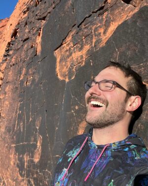 Bj Gruber Instagram - Helmet hair in the sky 👕 @rsvlts check out this cool@performance hoodie with Disney villains! #redrockcanyon #vegas #climber