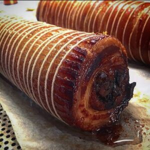 Björn Frantzén Instagram - Porchetta slowly grilled crispy over open fire is always a good idea - Preferably served with grilled lemon aioli, thyme roasted garlic (until sweet) and artichoke barigoule salad