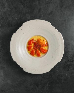 Björn Frantzén Instagram - Grilled marron, fermented carrot and curry condiment, saffron beurre blanc with lime @restaurantzen.sgp