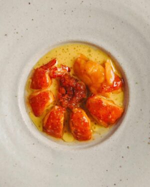 Björn Frantzén Instagram - Grilled marron, fermented carrot and curry condiment, saffron beurre blanc with lime @restaurantzen.sgp