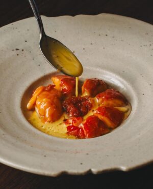 Björn Frantzén Instagram - Grilled marron, fermented carrot and curry condiment, saffron beurre blanc with lime @restaurantzen.sgp