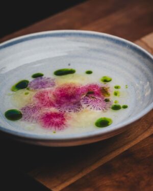 Björn Frantzén Instagram - Crudo: hamachi, tangelo, radish & marjoram - First serving in the dining room.

Sliced radishes for texture to the dish. Tangelo, which is a mix of mandarin, grapefruit, and pomelo, is fermented, and parts of it are used to create a vinaigrette with dashi and lime. The dish is finished with two oils: citrus leaf oil and marjoram oil @restaurantfrantzen