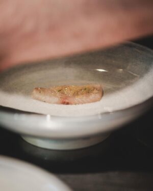 Björn Frantzén Instagram - Crudo: hamachi, tangelo, radish & marjoram - First serving in the dining room.

Sliced radishes for texture to the dish. Tangelo, which is a mix of mandarin, grapefruit, and pomelo, is fermented, and parts of it are used to create a vinaigrette with dashi and lime. The dish is finished with two oils: citrus leaf oil and marjoram oil @restaurantfrantzen