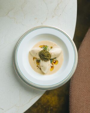 Björn Frantzén Instagram - Scallop quenelle, caviar, sauce vin jaune & barley koji butter @brasserieastoria.sg ⚡️⚡️⚡️