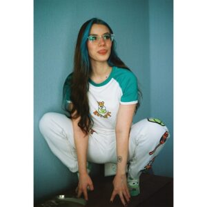 Blaine Gibson Instagram - Cristen has an unhealthy obsession with Keroppi since they share the same birthday so @dumbgood sent me a bunch of their Sanrio stuff in exchange for our firstborn child and a silly Keroppi photo shoot. Thank you @dumbgood for feeding my girlfriend’s addiction. 💚🐸
