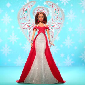 Bob Mackie Instagram - Thrilled to share that Bob has partnered with @mattelcreations to create a limited edition Barbie®️ Doll. The Bob Mackie Holiday Angel™️ sparkles like starlight in a floor length shimmering silver gown and a bright holiday red sash completes the look. Glittery wings soar behind her, while drop earrings and stacked bracelets, enhance her celestial sparkle.

The doll drops on November 9th at 9am PST. Link in Bio. Don’t miss out! #PaidPartnership