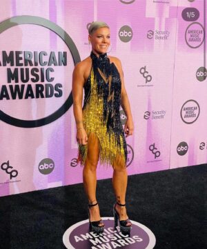 Bob Mackie Instagram - @pink pictured wearing an archive Bob Mackie gown on the @amas red carpet. The ‘Earthquake dress’ is from his 1987 California collection and is made using jet sequins and citron bugle bead fringe.

Bob says; “This is the perfect dress for Pink as a performer and for the AMA's red carpet tonight!” #mackiemagic