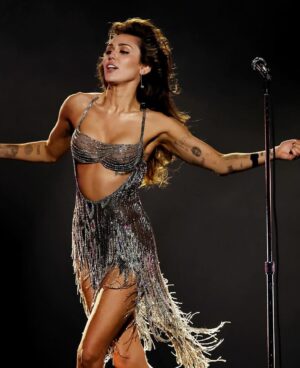 Bob Mackie Instagram - @mileycyrus wears a Bob Mackie couture silver bugle-beaded strip dress, from his 2002 ‘To Broadway With Love’ collection. Congrats on your Grammy win, Miley! xo Bob

Styled by: @bradleykennethstyle 

#bobmackie #grammys2024 #mackiemagic #mileycyrus