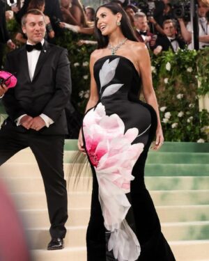 Brad Goreski Instagram - @demimoore in @cartier jewelry and a custom @harris_reed gown. The gown is made with a 60 year old panel of archival silk wallpaper that has 11000 hours of embroidery on it. We wanted the gown to reflect the blooming and decay of a flower. The chiffon petals at the bottom of the gown are hand painted. Harris and his amazing team put this look together in two weeks. The necklace has 7.87 carats of emeralds and is called the Kloris after the Greek nymph of flowers and plants. 
Styled by me 
Makeup by @kristoferbuckle 
Hair by @djquintero 
Nails by @akinailsnyc 
#metgala