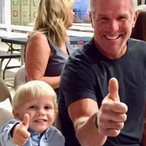 Brett Favre Instagram - Thumbs Up from our Grandson, AJ and I celebrating baby Oscar’s Baptism!